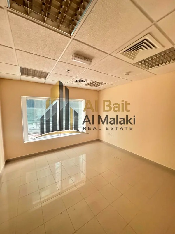 Office for rent in Al Qasba, a very beautiful commercial building, prime location close to all vital centers, free air conditioning. photo 4